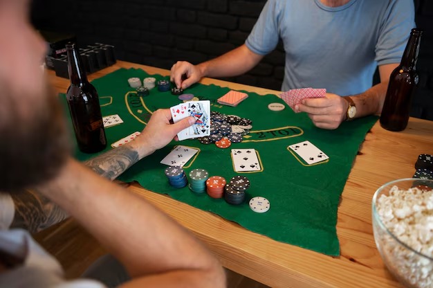 Live dealer at Jewels of Prosperity table on hometogel, showing card layout and studio setup